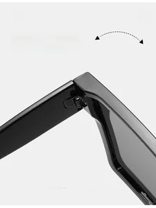 Macro close-up of durable metal hinges on classic black wide frame sunglasses
