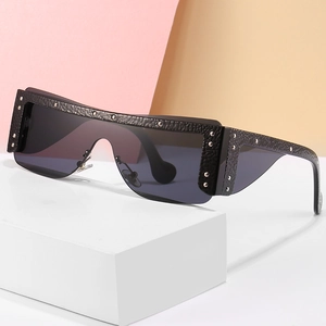 Modern oversized shield sunglasses with black leather texture and metal stud details