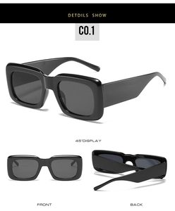 Detailsicht der quadratischen Sonnenbrille mit breiten Bügeln und dunklen Gläsern