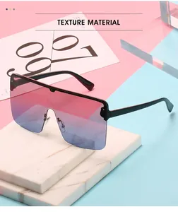Detailed view of oversized one-piece shield sunglasses for women with black frames