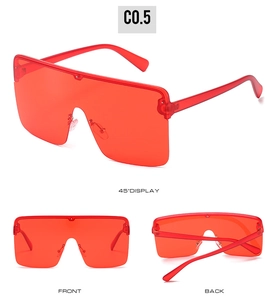 Three-angle display of oversized transparent red shield sunglasses in C0.5 color
