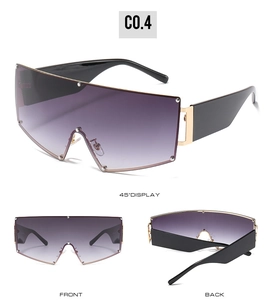 Detailed view of oversized purple gradient shield sunglasses with silver rivet accents