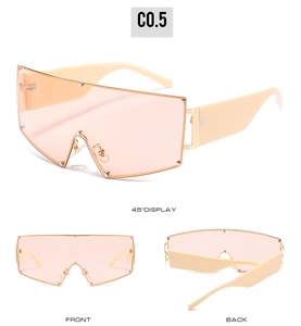 Detail view of oversized sunglasses with peach lenses and cream-colored riveted frames