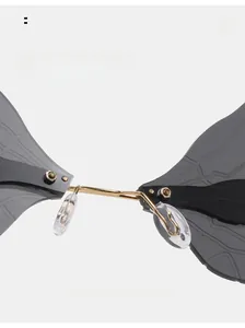 Detail of steampunk dragonfly wing sunglasses with soft nose pads and gold metal bridge
