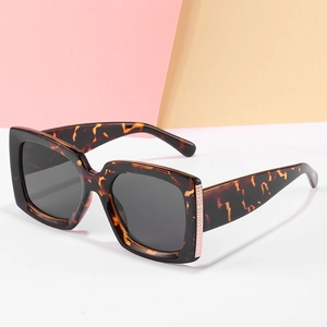 Classic oversized square tortoiseshell sunglasses with gold metal accents on frame
