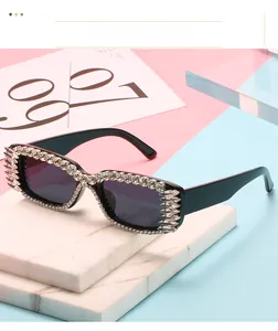 Macro view of black rectangular sunglasses with spiked rhinestones in Y2K style