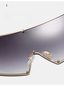 Detail of comfortable nose pads on oversized sunglasses with purple gradient lenses