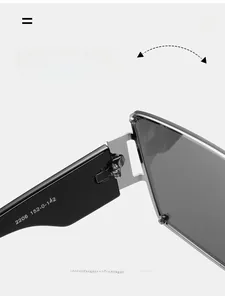 Detail view of high-quality metal hinge structure on oversized black sunglasses