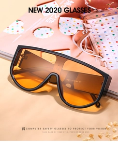Detail view of oversized shield sunglasses with orange lenses and printed model parameters