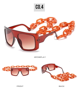 Detail view of hip-hop square sunglasses with bold orange acrylic chain and acetate frame