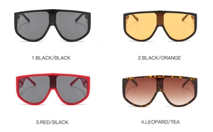 Detail view of four oversize one-piece sunglasses in black, orange, red and leopard print