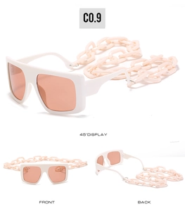Macro detail of white square frame sunglasses with pink lenses and acrylic chain
