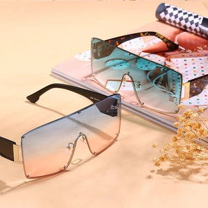 Oversized rimless shield sunglasses with gradient lenses and elegant metal hinges