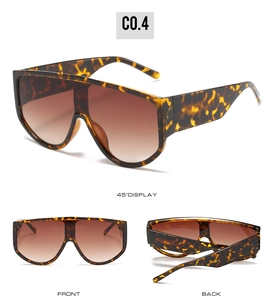 Detail view of tortoiseshell oversized shield sunglasses with gradient tea lenses in multi-angles