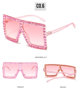 Detail view of oversized square pink sunglasses with rhinestone crystals on frames