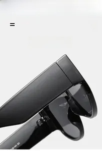 Detail of wide temple hinge and model 18-141 C1 on black oversized sunglasses