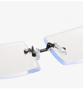 Detail view of square blue light glasses with soft silicone nose pads and metal bridge