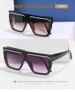 Macro detail of oversized square sunglasses with tortoise and black frames in gradient lenses