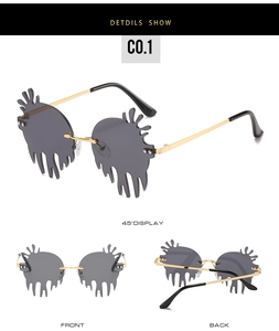 Detailed views of gold frame sunglasses with irregular grey melting effect lenses