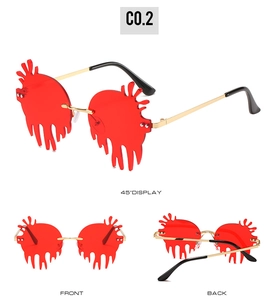 Three views of heart-shaped dripping sunglasses in red lens with gold metal frame