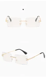 Detail view of square rimless glasses showing gold metal bridge and black temple tips