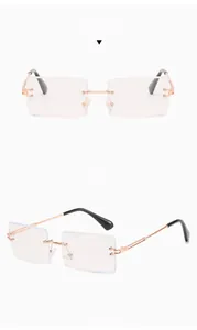 Detail view of rose gold rimless rectangular glasses showing positive and side perspectives