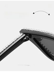 Detail of durable metal hinge and hand-set rhinestones on black cat eye sunglasses