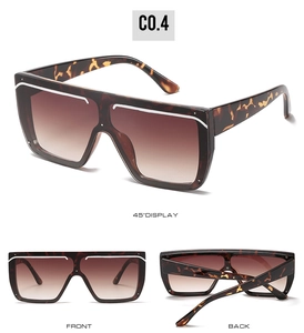 Detail view showing tortoise shell sunglasses with gradient lenses and white trim accents