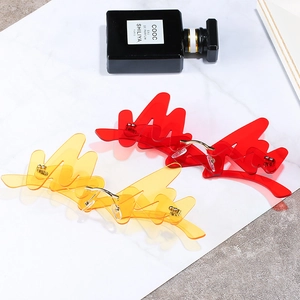 Unique flame-shaped rimless sunglasses in red and yellow with gold metal bridges and nose pads