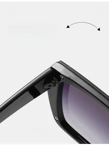 Detail of durable metal reinforced hinge on oversized square sunglasses with purple lenses