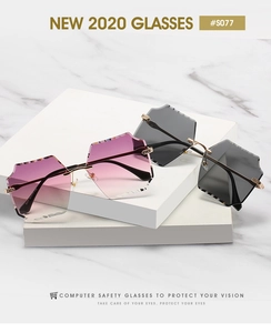 Detail of rimless geometric sunglasses with carved lens edges and slim metal temples