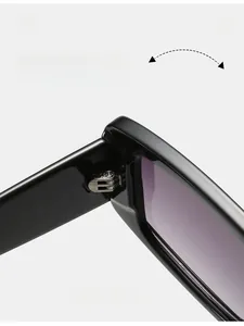 Detail shot of durable metal hinges on vintage black square frame sunglasses with gradient lenses