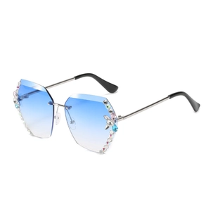 Lunettes de soleil sans monture bleu dégradé avec verres polygonaux sertis de diamants