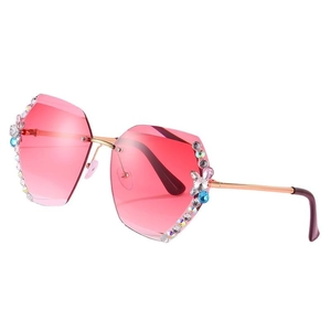 Lunettes de soleil sans monture dégradé rose avec papillon en strass et monture dorée