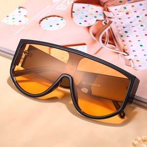Oversized one-piece orange lens sunglasses with matte black frames for fashion styling