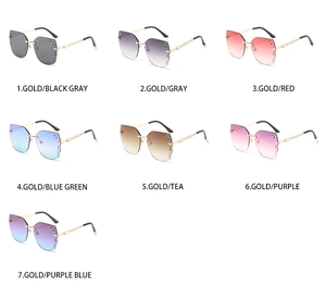 Macro view of seven rimless butterfly sunglasses with sparkling rhinestone lens edges