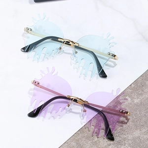 Chic rimless caterpillar sunglasses with fluid drip flame lenses and gold metal frame