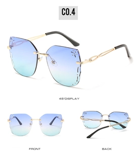 Three-way view of oversized rimless butterfly sunglasses with rhinestones and gradient lenses