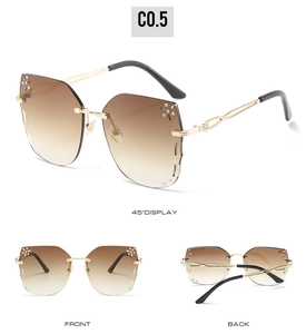 Three-view display of rimless butterfly sunglasses with rhinestone stars and gold temples