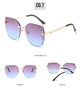 Detail view of rimless butterfly sunglasses with purple gradient lenses and rhinestones