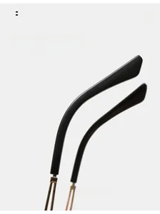 Detail of elegant gold metal sunglasses legs with curved design for comfortable wear