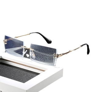 Modern rimless square glasses with blue gradient glitter lenses and gold metal temples