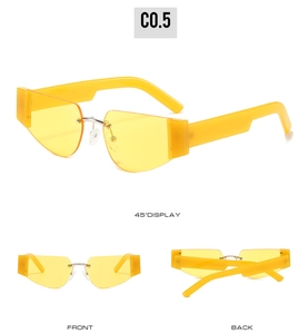 Detaillierte Ansicht der gelben flügelförmigen Sonnenbrille mit dicken Bügeln und Steg