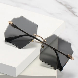 Frameless square sunglasses with grey gradient lenses and gold patterned metal temples