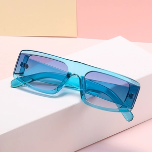 Retro small square sunglasses with translucent blue frames and purple gradient lenses