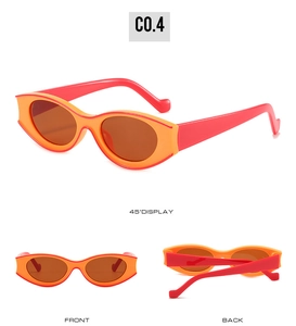 Detailed view of oval vintage sunglasses with orange and red two-tone frames