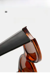 Macro shot of high-quality metal hinges on amber tortoiseshell oval sunglasses