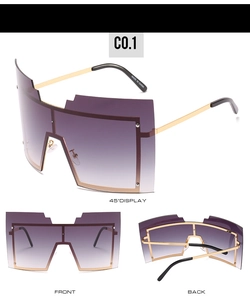 Vue détaillée de lunettes de soleil carrées oversize dégradées avec monture en métal doré