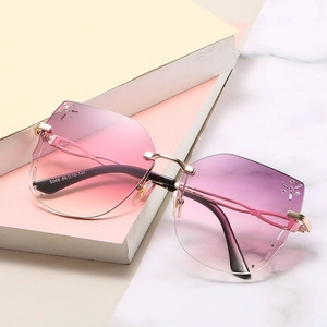Pink gradient rimless butterfly sunglasses with rhinestones and gold metal frame
