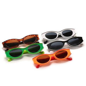 Retro small oval sunglasses set in tortoiseshell green white black and orange colors
